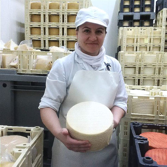 Fátima Navarro is holding artisan cheese.