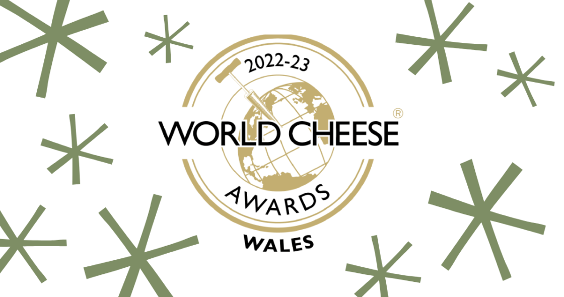 World Cheese Awards 2022-23 logo with green stars around it